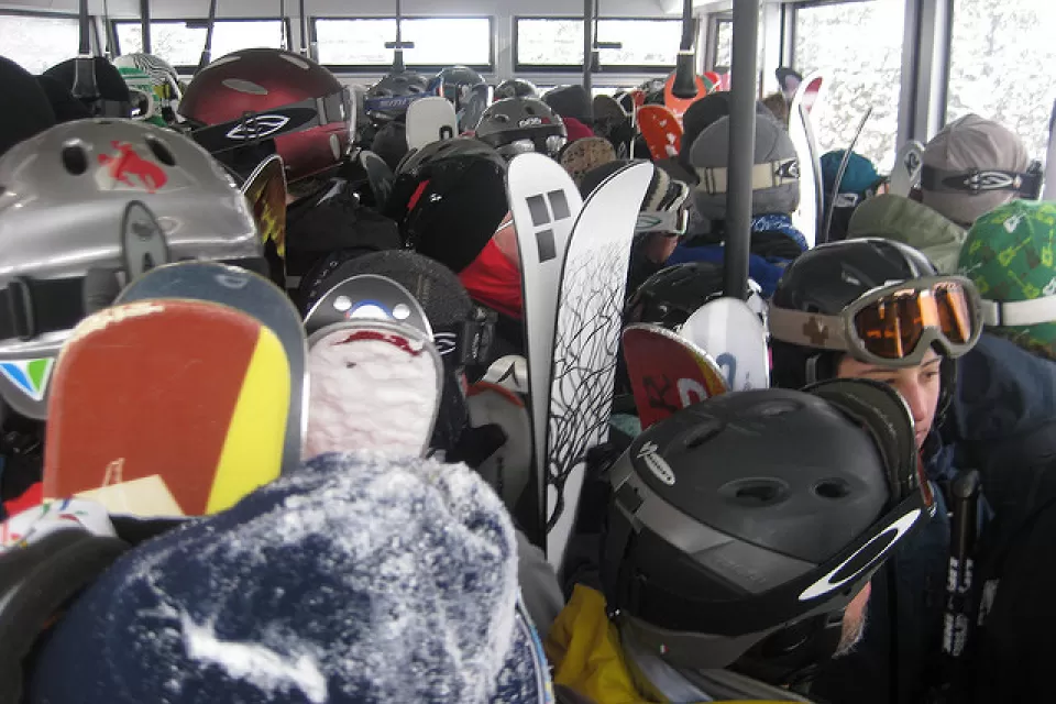 skiers on a tram